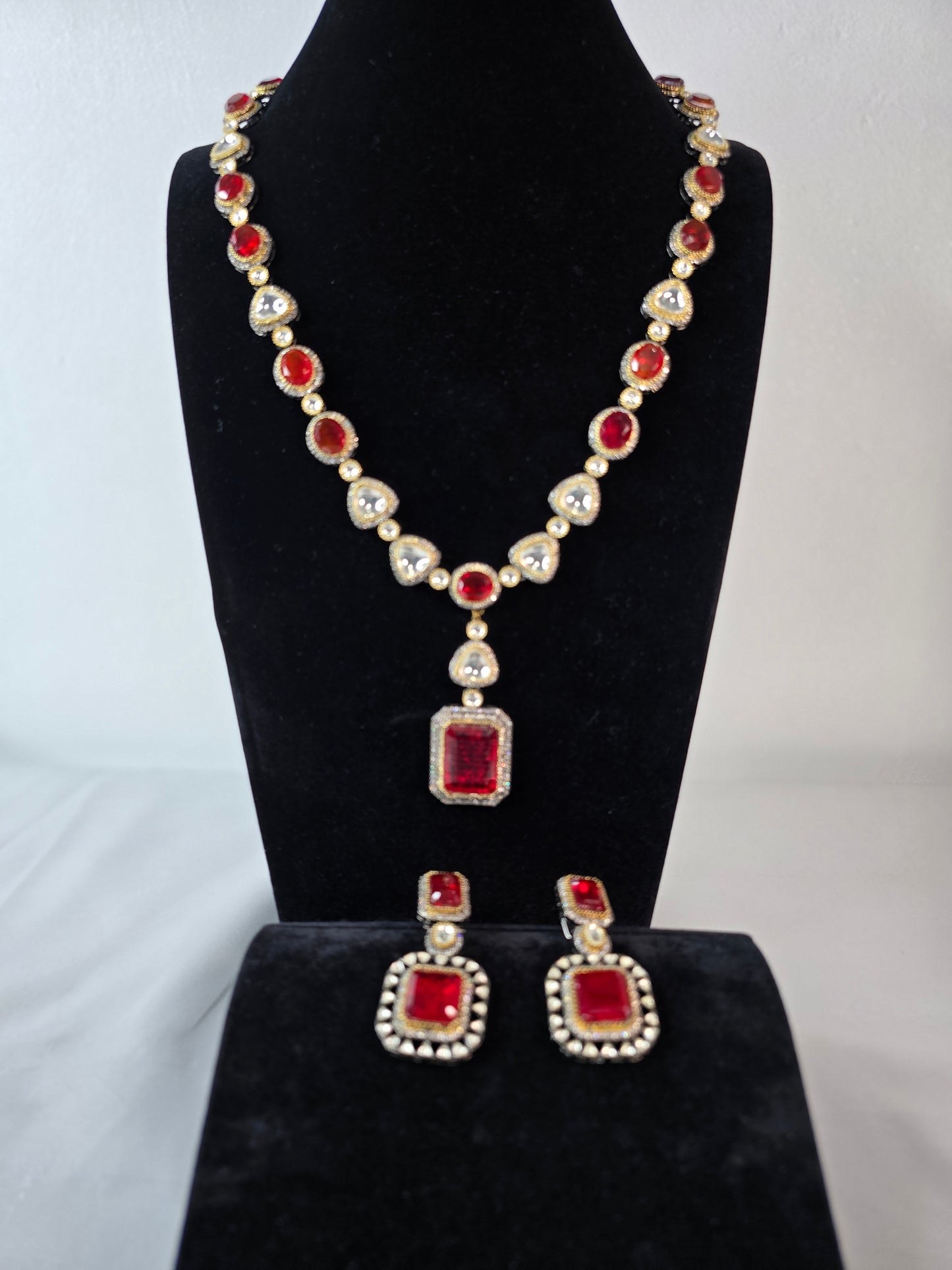 Moissanite Red & Clear Moissanite on Pure brass with a Black Rhodium victorian finish long Mala & Earing set. Hand made only two ever made, collectors piece. Premium kundan jewellery
