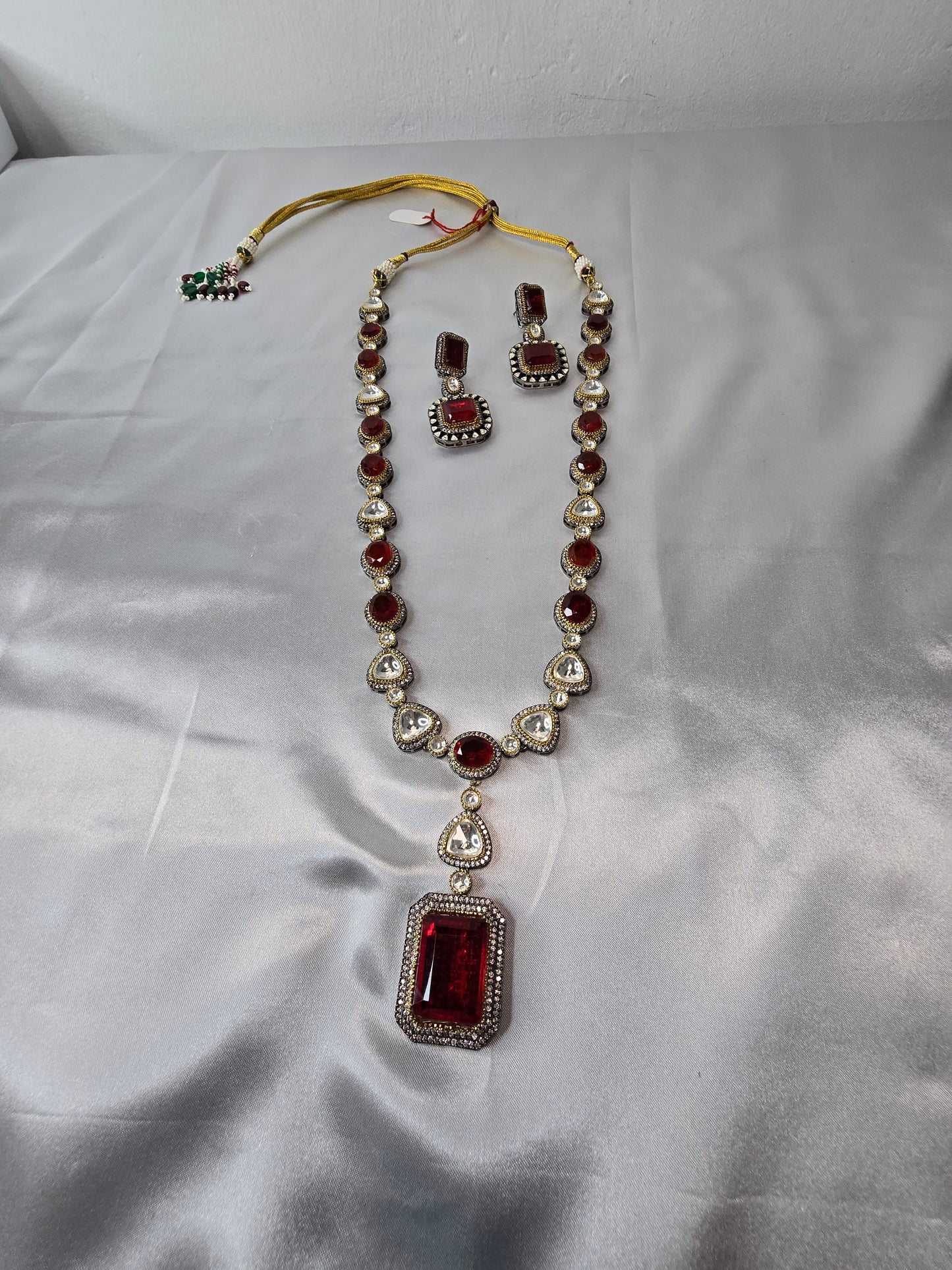 Moissanite Red & Clear Moissanite on Pure brass with a Black Rhodium victorian finish long Mala & Earing set. Hand made only two ever made, collectors piece. Premium kundan jewellery