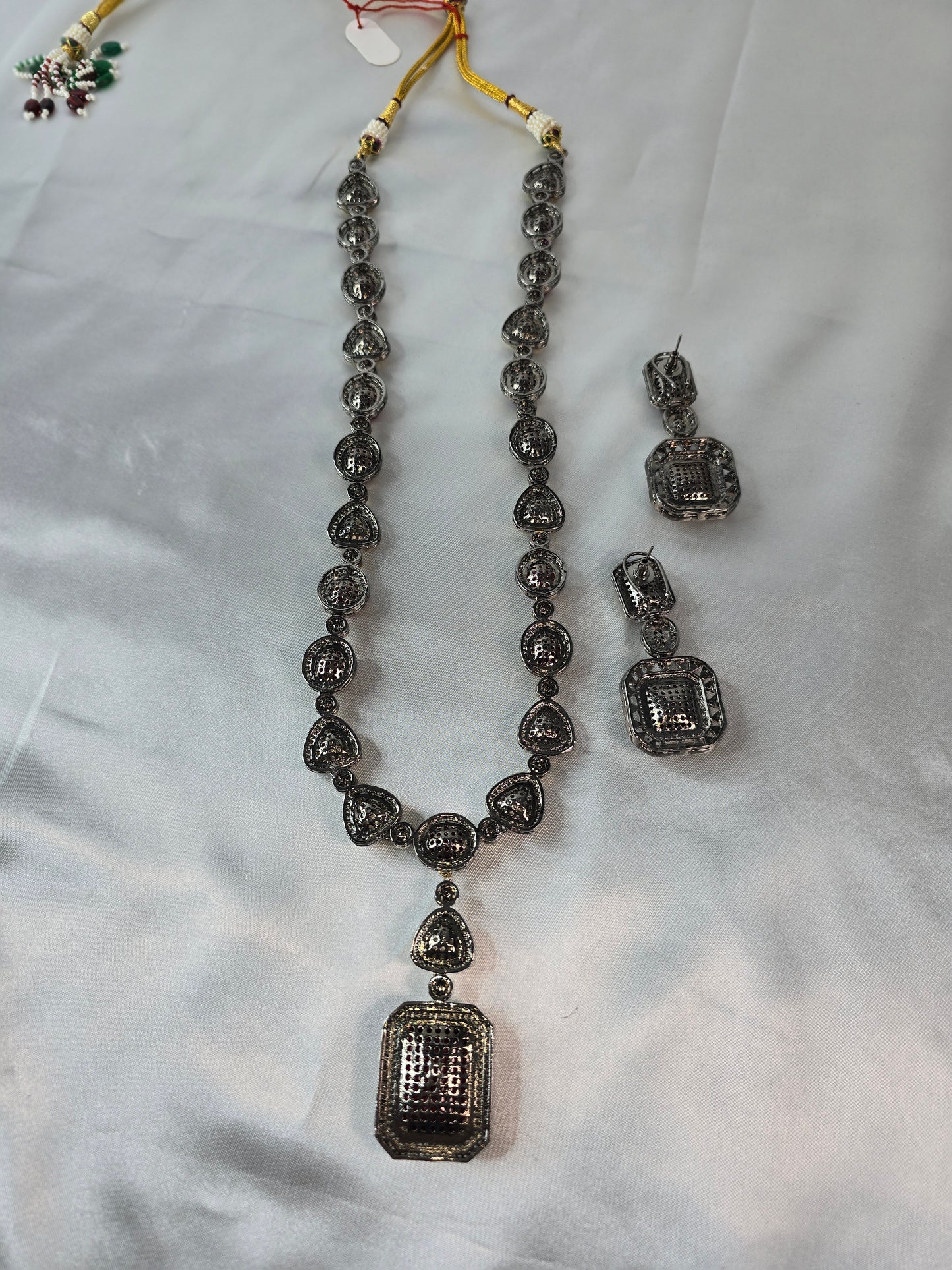 Moissanite Red & Clear Moissanite on Pure brass with a Black Rhodium victorian finish long Mala & Earing set. Hand made only two ever made, collectors piece. Premium kundan jewellery