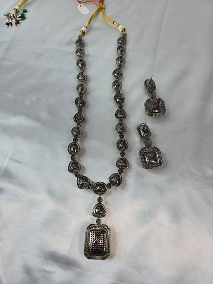 Moissanite Red & Clear Moissanite on Pure brass with a Black Rhodium victorian finish long Mala & Earing set. Hand made only two ever made, collectors piece. Premium kundan jewellery